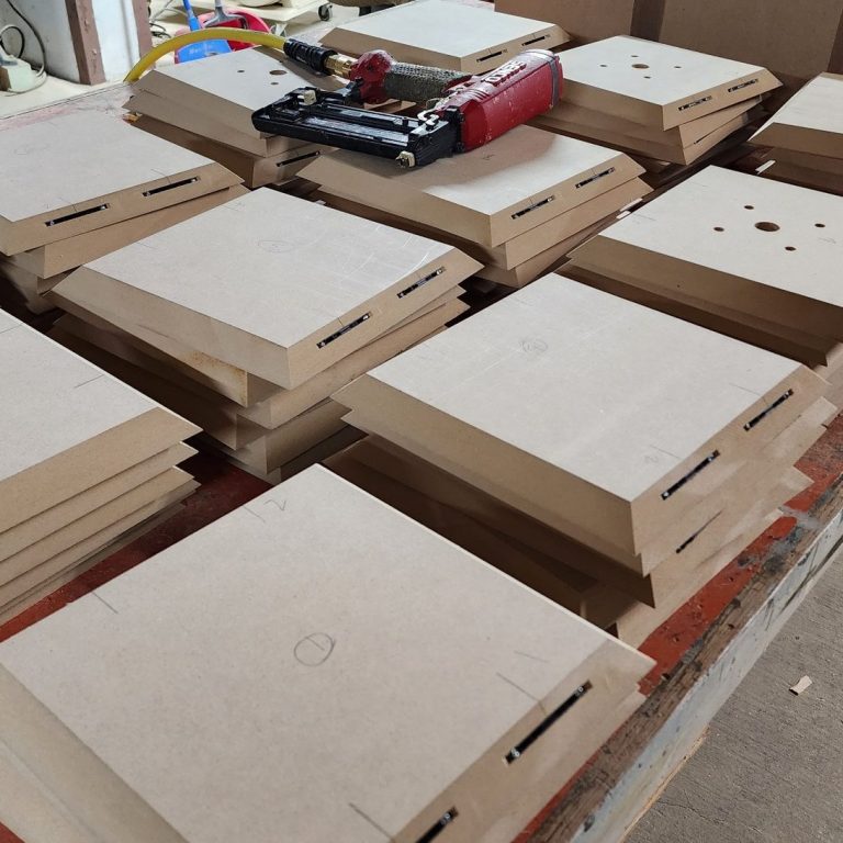 Fabrication Precision cut components arranged across a work surface